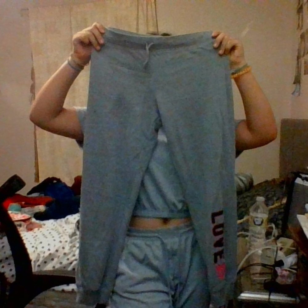 Grey joggers with the word love at the bottom for girls.